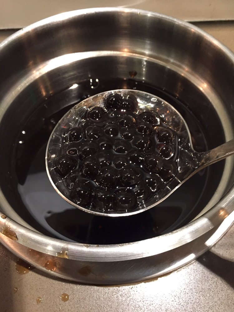 A ladle of fresh tapioca boba pearls at the self-serve bar