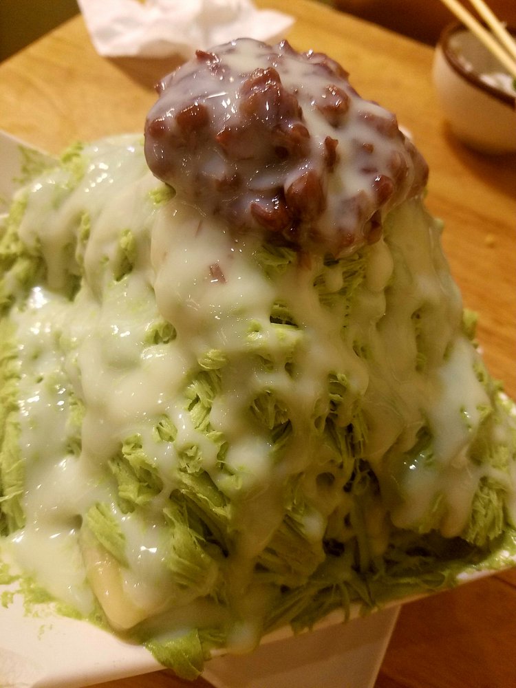 Green tea shaved snow piled high with red bean and condensed milk